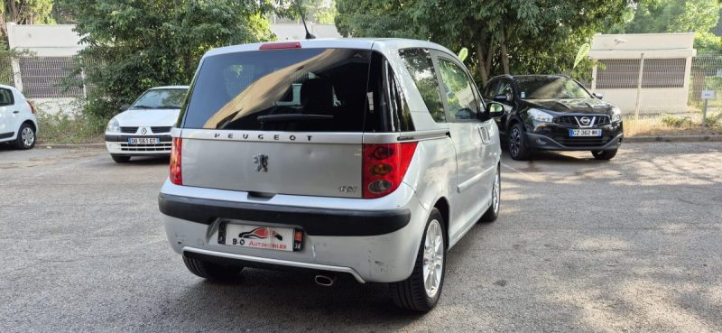 Peugeot 1007 1.4l TU 75ch gris BVA 5, *Climatisation*, *Peu kilométrés*